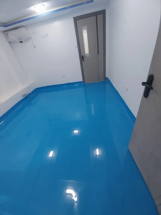 Blue epoxy floor in a clinical room