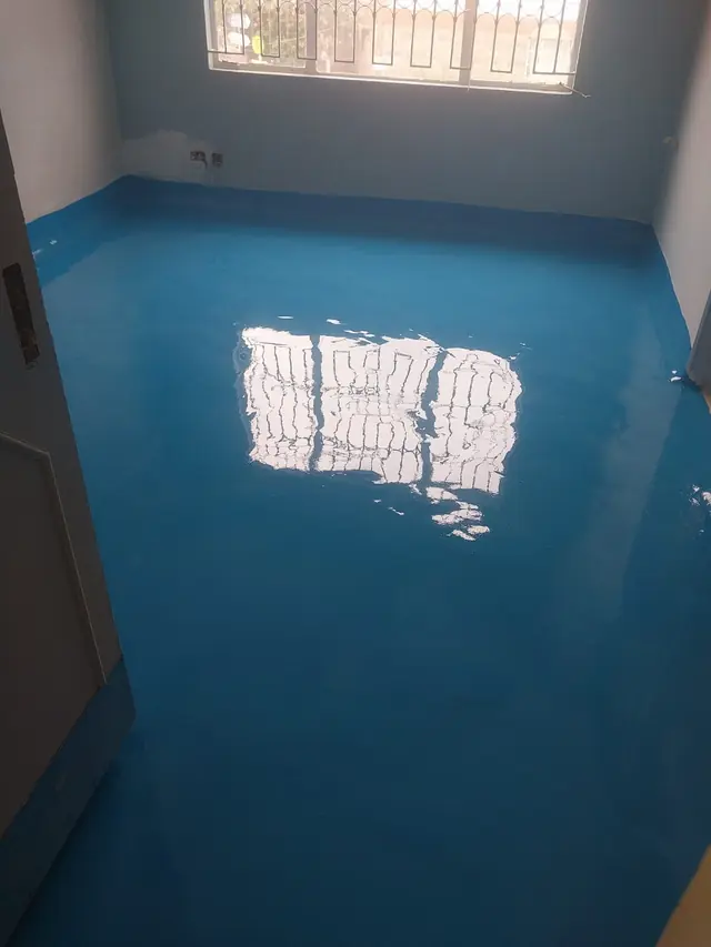 Blue epoxy floor with coved skirting