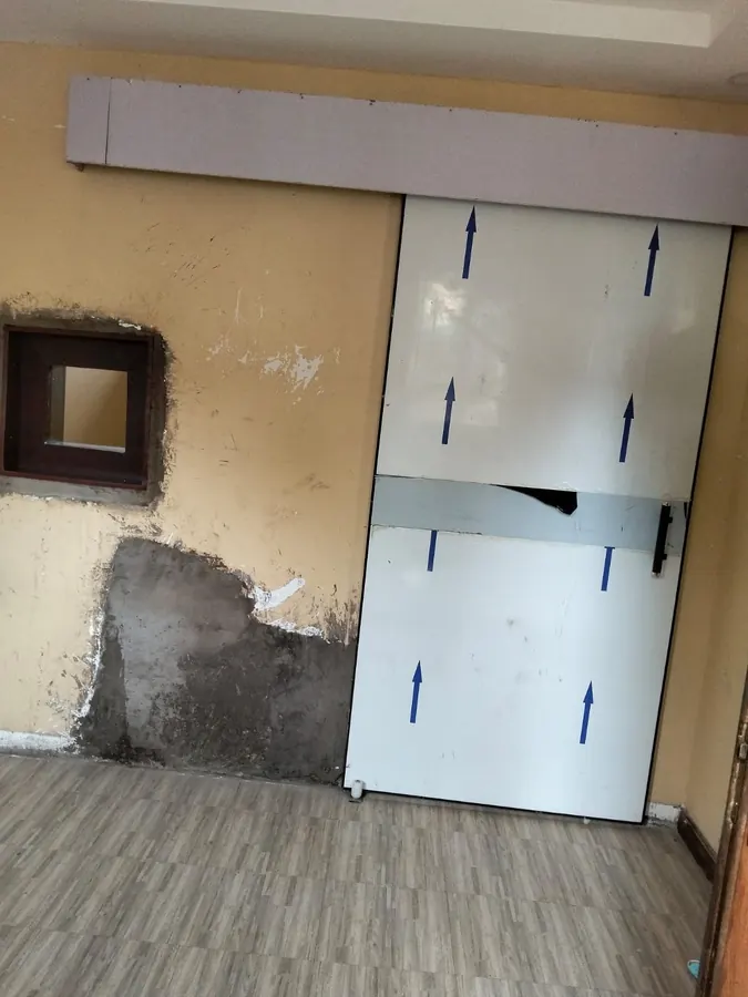 Lead-lined sliding door in an X-ray room